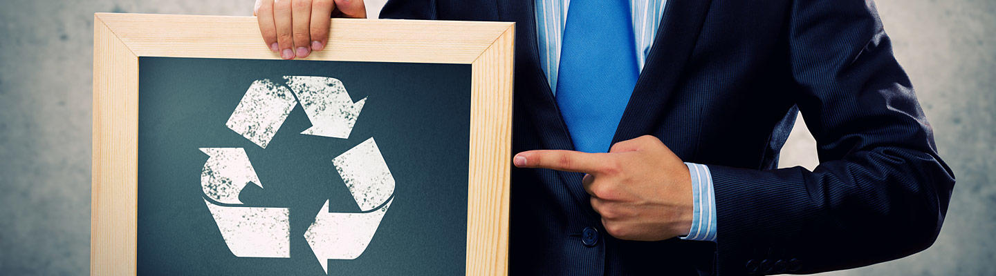 Man holding a recycling sign